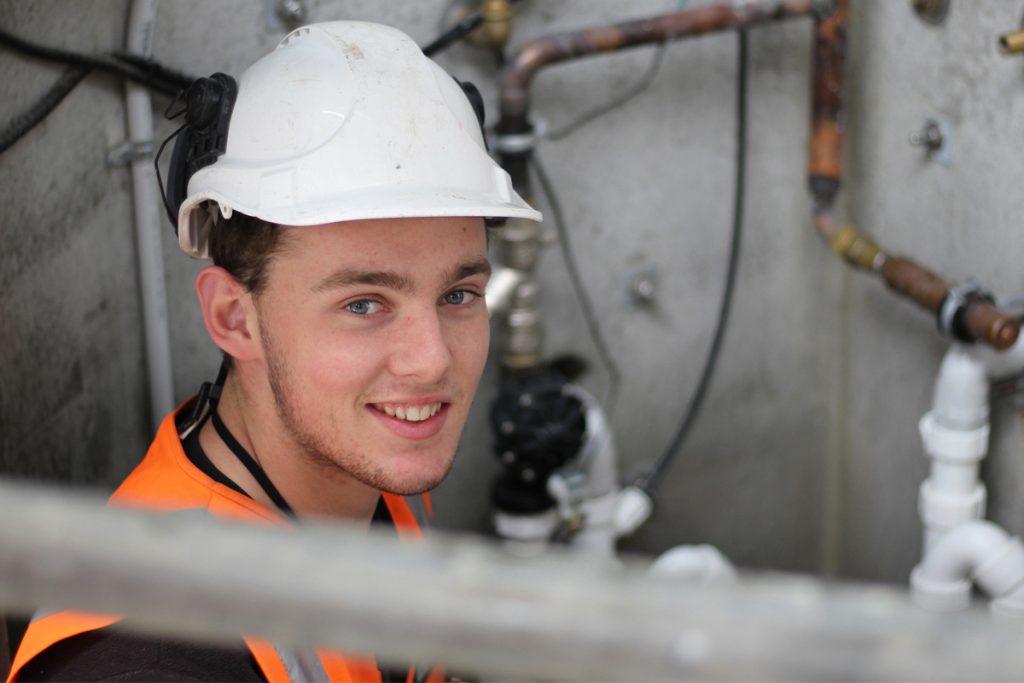 Trade apprentice gaining hands-on experience in the workplace