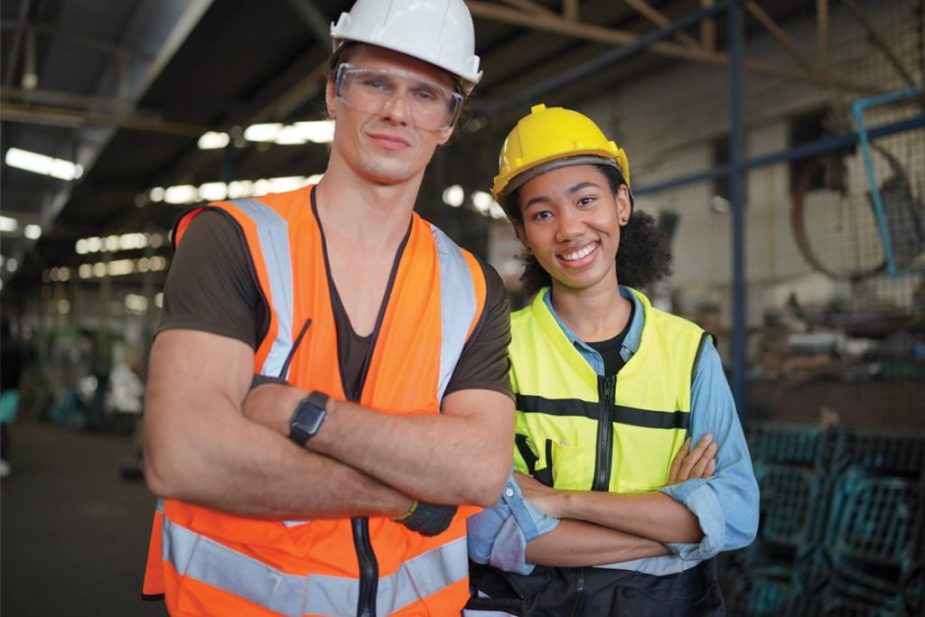 Trade apprentice and trade assistant wearing safety gear at a worksite, representing apprenticeship, recruitment and workforce solutions for New Zealand trade employers.